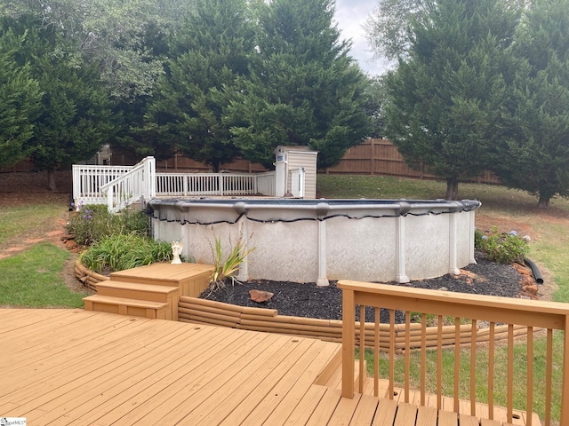 wooden terrace featuring a covered pool