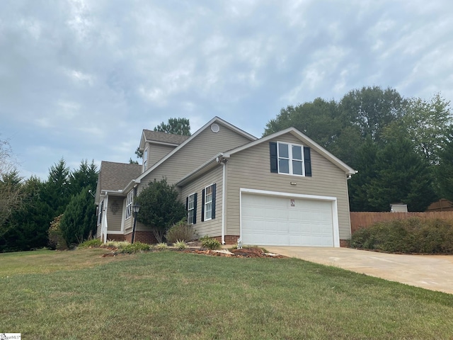 view of front property with a front lawn and a garage