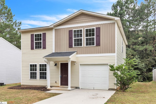 view of front of property with a garage and a front lawn