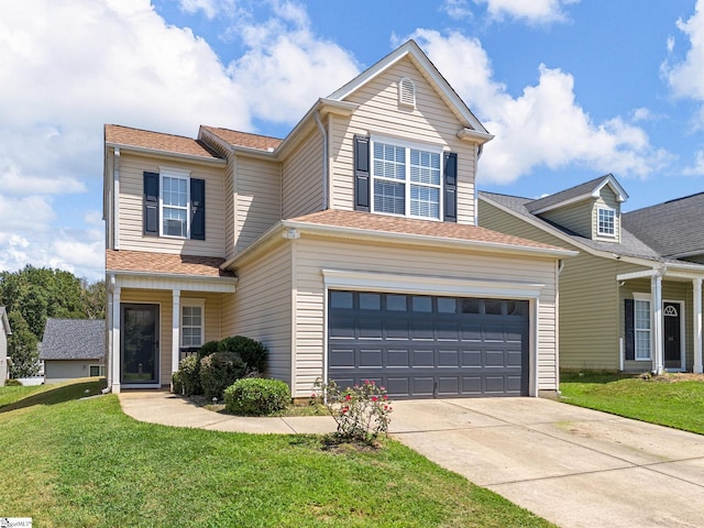 view of front facade with a garage and a front lawn