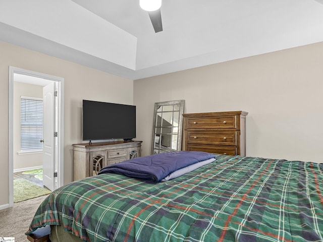 carpeted bedroom featuring connected bathroom and ceiling fan