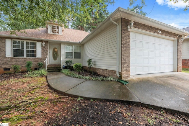 view of front of property with a garage