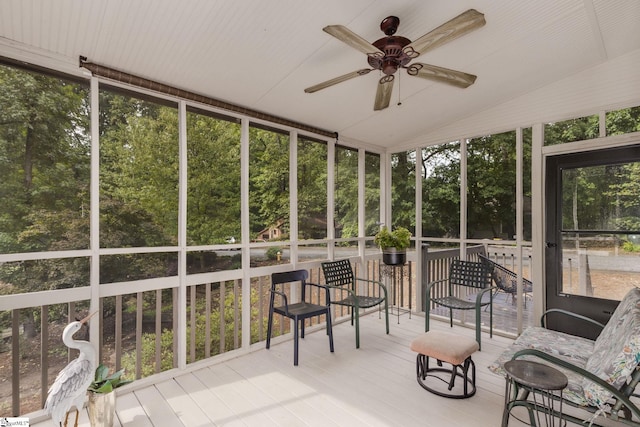 sunroom featuring vaulted ceiling and ceiling fan