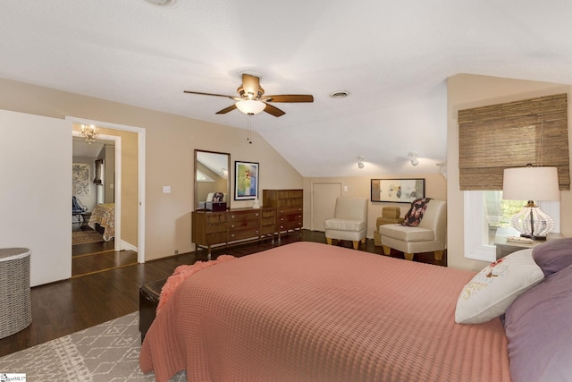 bedroom with vaulted ceiling, ceiling fan, and dark hardwood / wood-style floors