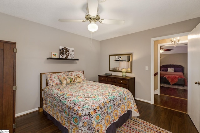 bedroom featuring ceiling fan and dark hardwood / wood-style floors