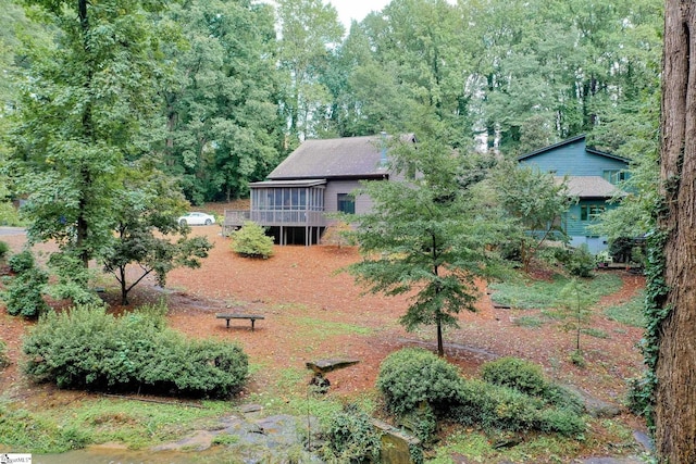 view of yard featuring a sunroom