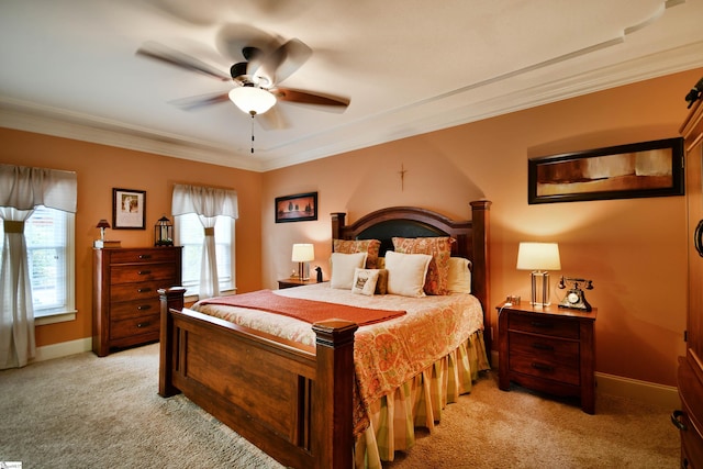 carpeted bedroom with ceiling fan and crown molding