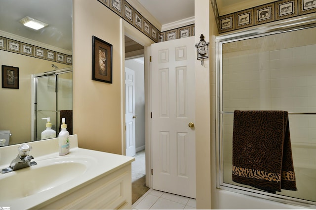 bathroom featuring vanity, crown molding, a shower with door, toilet, and tile patterned floors