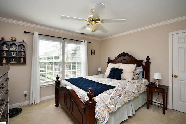 bedroom with ceiling fan, light carpet, and ornamental molding