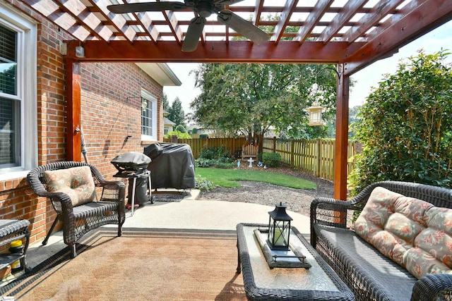 view of patio / terrace with area for grilling and a pergola