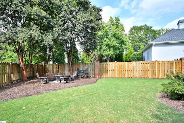 view of yard with an outdoor fire pit