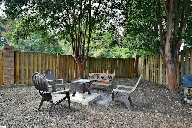 view of patio with a fire pit