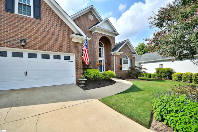 front of property featuring a front yard and a garage