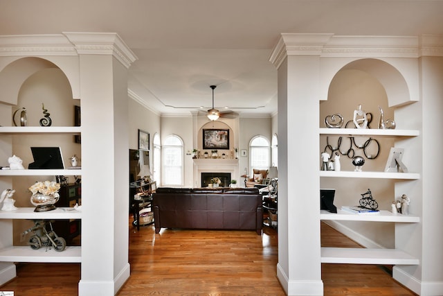 interior space featuring hardwood / wood-style floors and crown molding