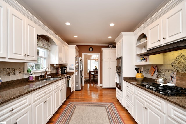 kitchen featuring ornamental molding, black appliances, white cabinetry, dark stone countertops, and dark hardwood / wood-style flooring