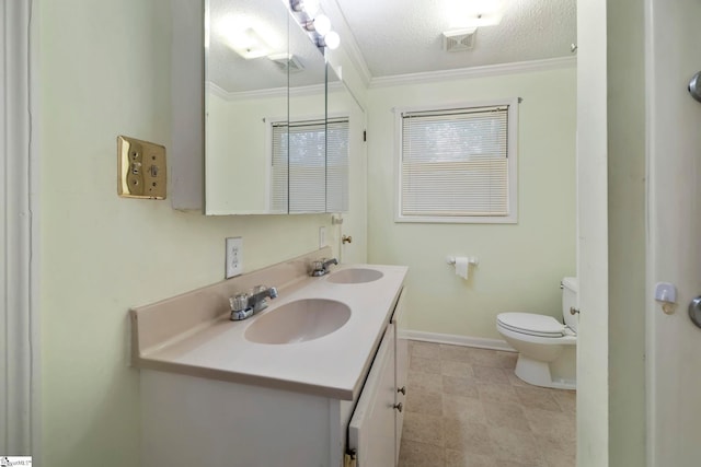 bathroom featuring vanity, crown molding, toilet, and a textured ceiling