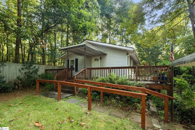 back of property featuring a wooden deck