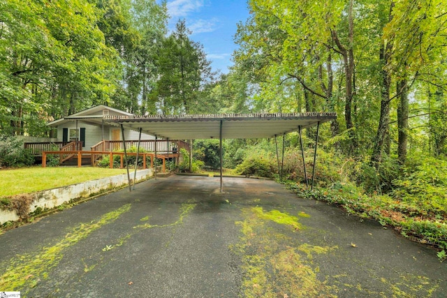 view of parking / parking lot with a carport