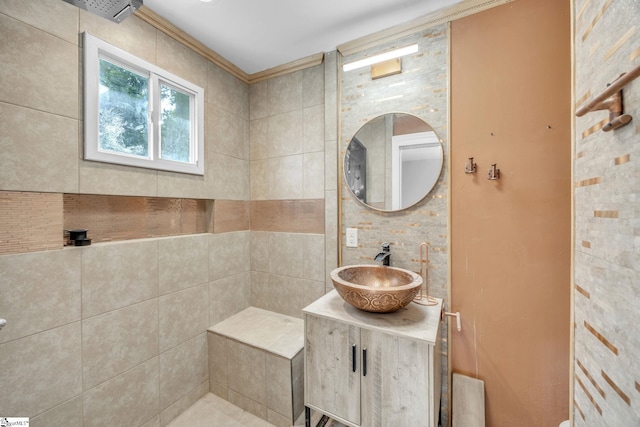 bathroom with vanity, tile walls, and crown molding