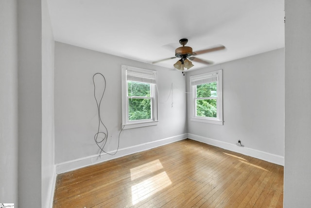 unfurnished room with light hardwood / wood-style flooring and ceiling fan