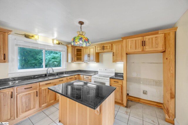 kitchen featuring light tile patterned floors, sink, electric range, a center island, and dark stone countertops