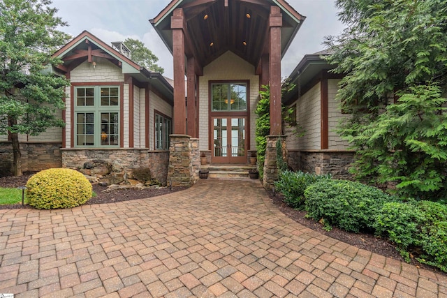 view of exterior entry featuring french doors