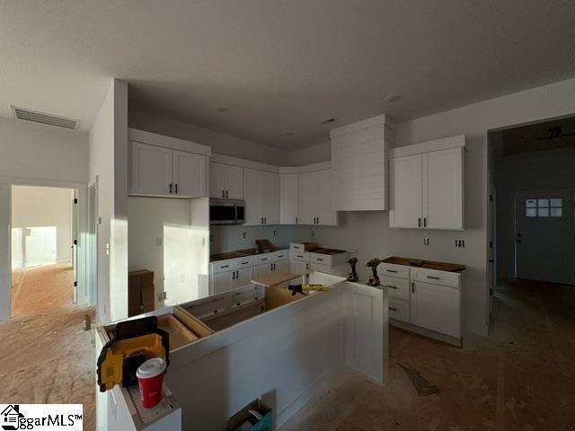 kitchen featuring white cabinetry