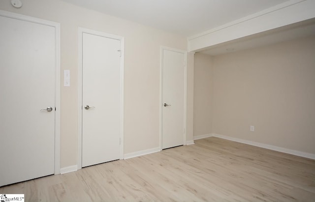 unfurnished bedroom with light hardwood / wood-style floors