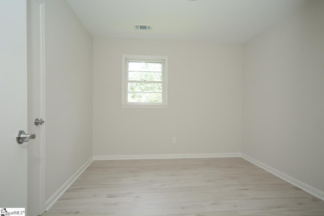 unfurnished room featuring light hardwood / wood-style flooring