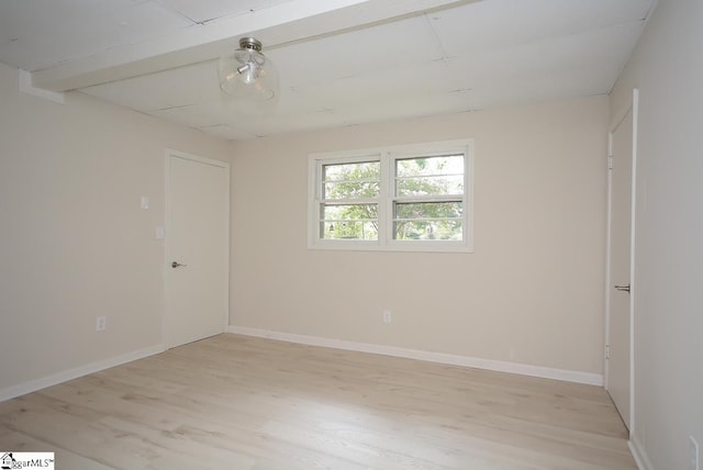 spare room featuring light wood-type flooring