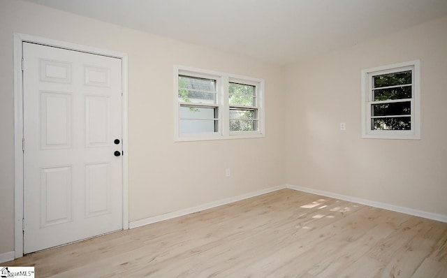 unfurnished room featuring light hardwood / wood-style floors