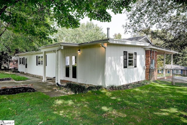 exterior space with a lawn and a patio