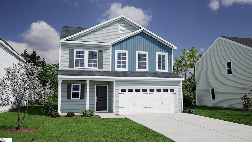 front of property with a garage and a front yard