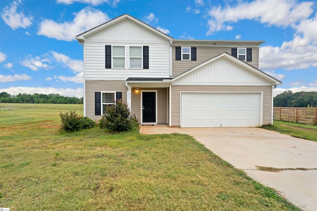 view of front of home with a garage and a front lawn