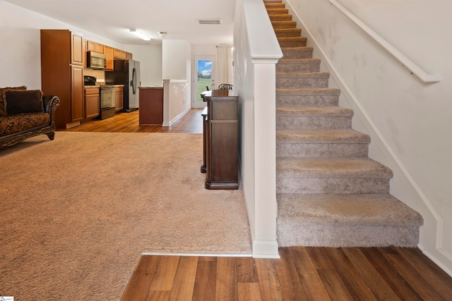 stairway with wood-type flooring