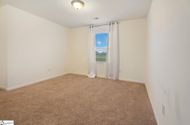 spare room featuring carpet flooring