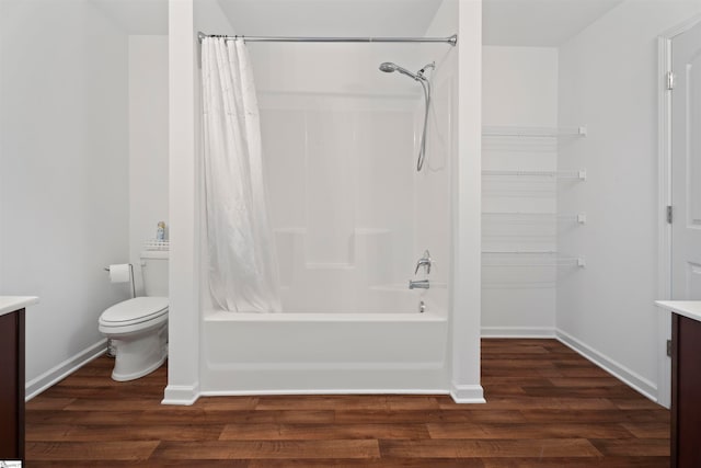 full bathroom with shower / tub combo with curtain, vanity, toilet, and hardwood / wood-style flooring