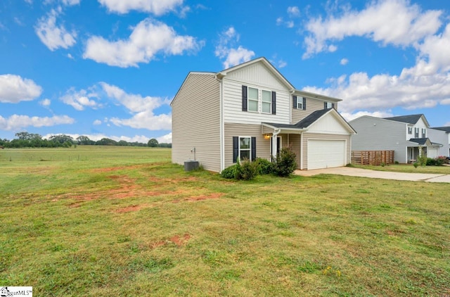 view of front of house with a garage and a front yard