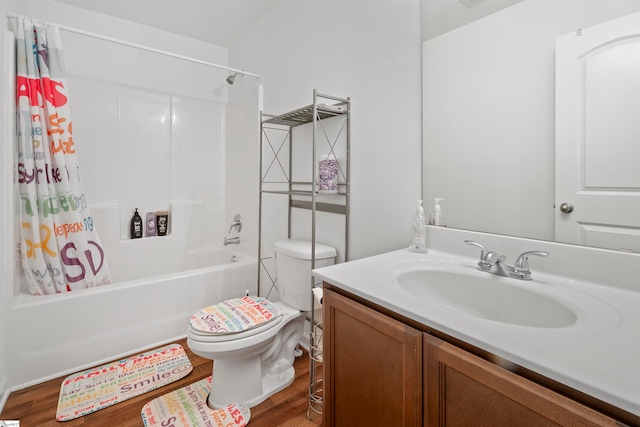 full bathroom featuring wood-type flooring, vanity, shower / tub combo, and toilet