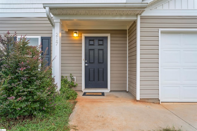 doorway to property featuring a garage