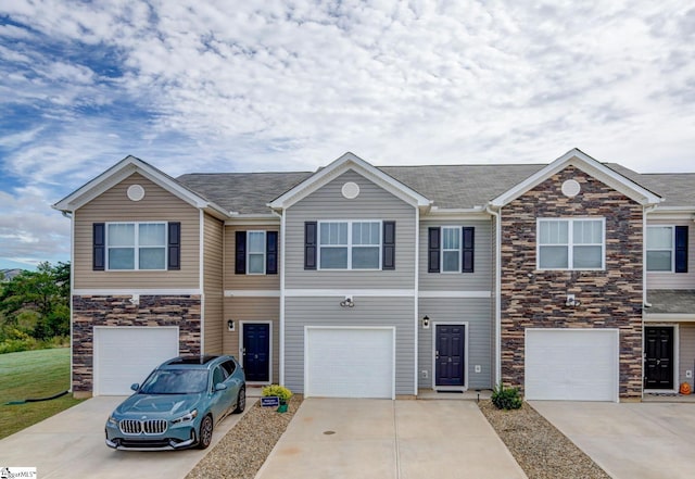 multi unit property featuring a garage