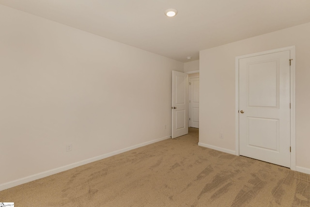 unfurnished bedroom featuring light colored carpet