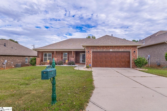 ranch-style home with a garage, a front yard, and central AC