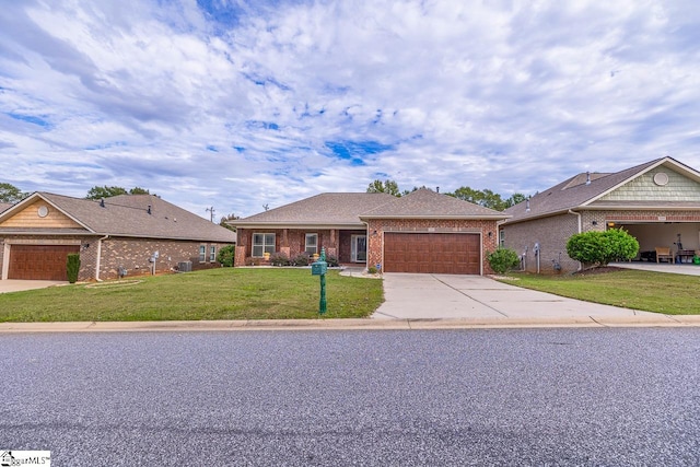 single story home featuring a garage and a front lawn