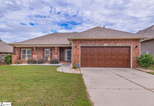 ranch-style home with a front yard and a garage