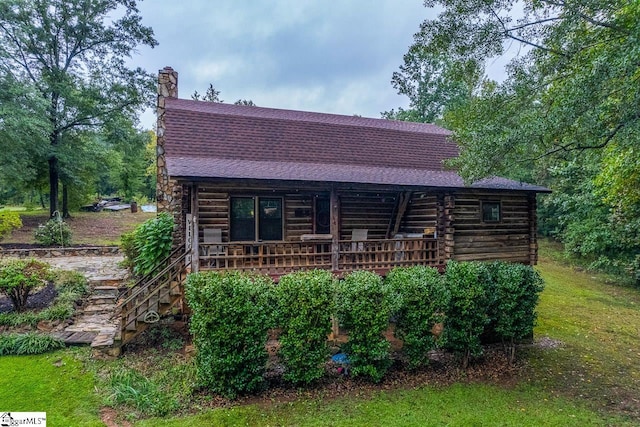 view of log cabin