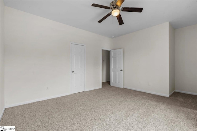 carpeted empty room with ceiling fan