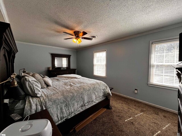 bedroom featuring a textured ceiling, carpet flooring, multiple windows, and ceiling fan