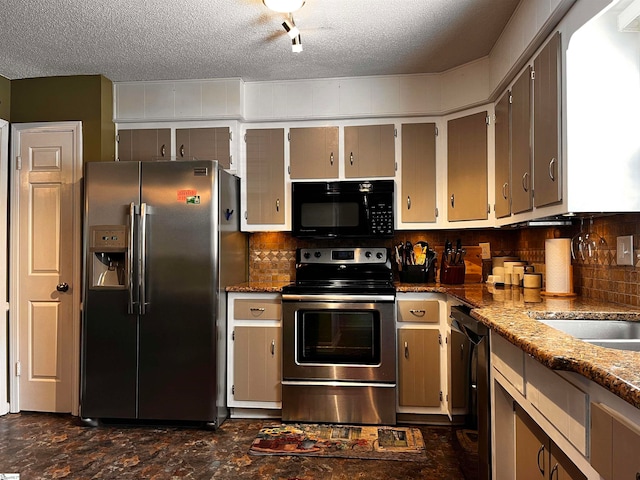 kitchen featuring black appliances, tasteful backsplash, a textured ceiling, light stone countertops, and sink