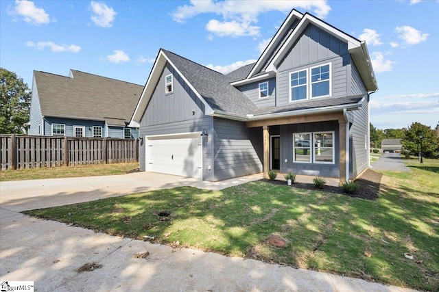 view of front of house with a front lawn and a garage